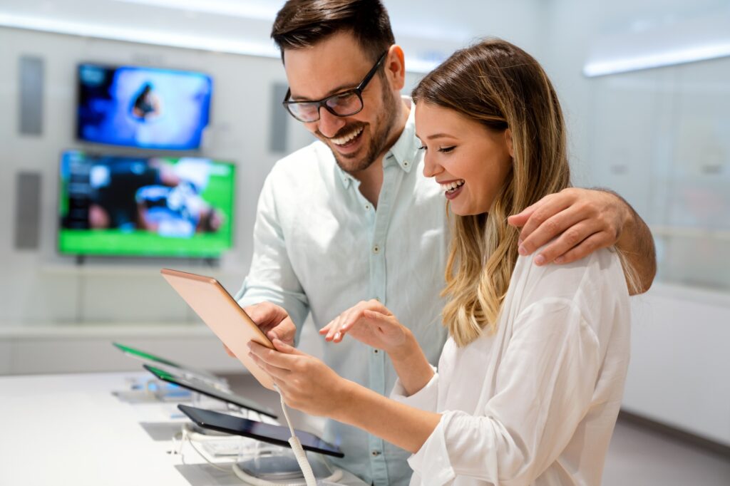 Happy users browsing Best Tech Deals 2025 on tablet 