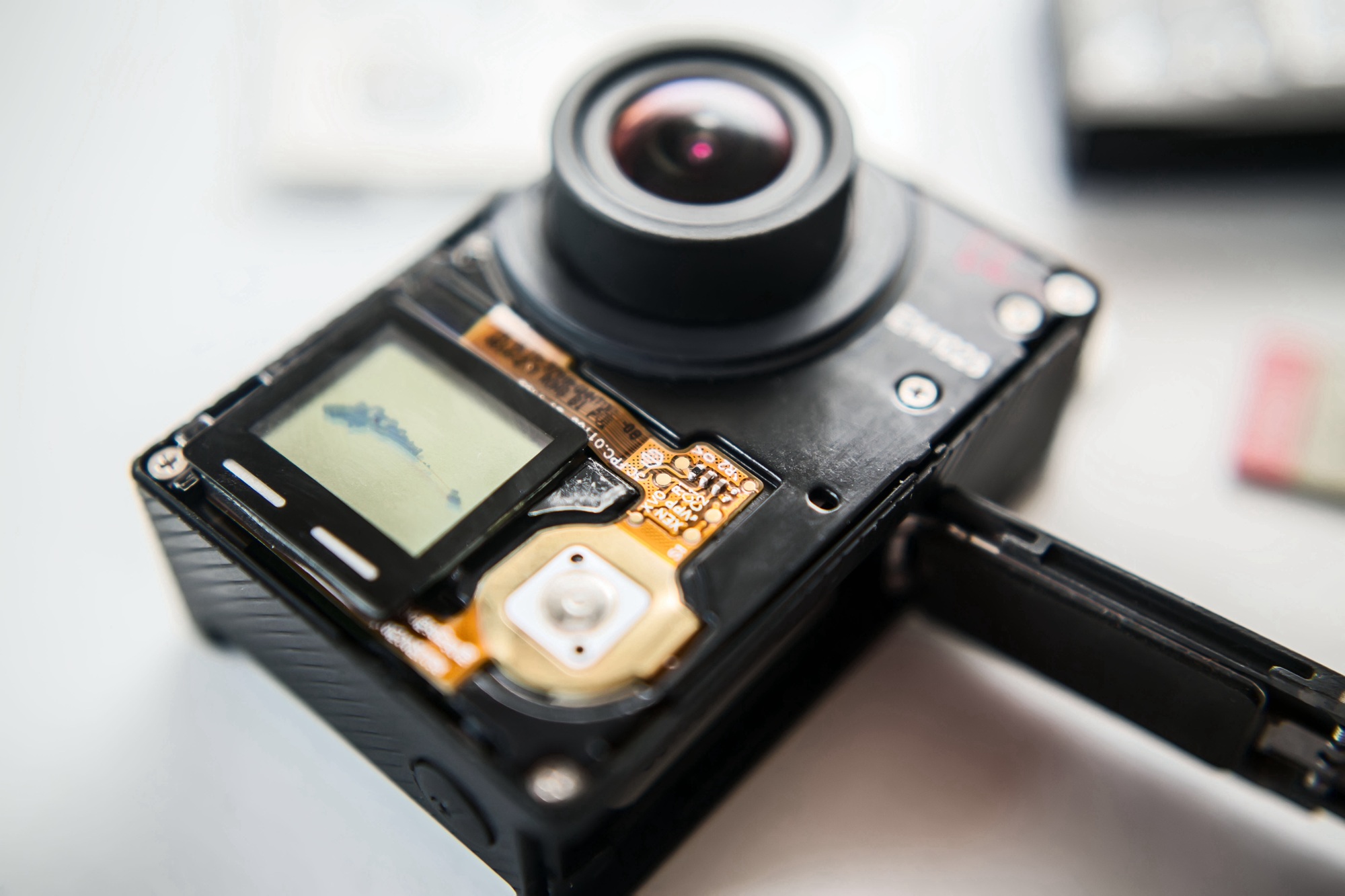 Close-up of a disassembled GoPro Max camera showcasing its internal components and lens design—ideal for professionals looking to buy GoPro Max camera models.


