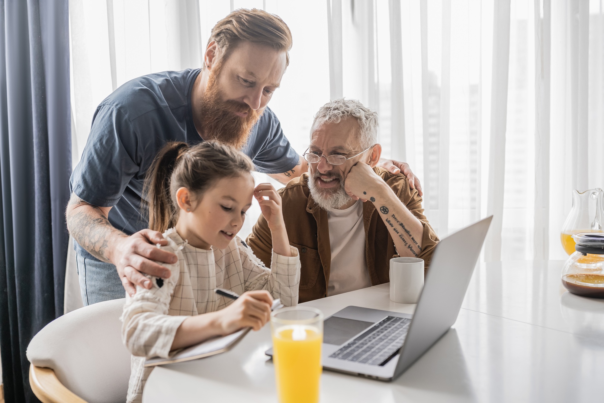 Family using a Chromebook at the kitchen table, highlighting convenience and accessibility for learning and productivity—ideal for those looking to buy Chromebooks online.